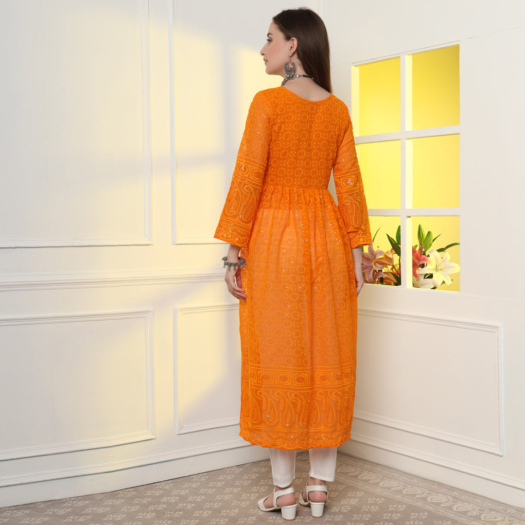 A Touch of Lucknowi Luxury: The Paisley Embroidered Chikankari Kurta Set with intricate white embroidery on elegant fabric.