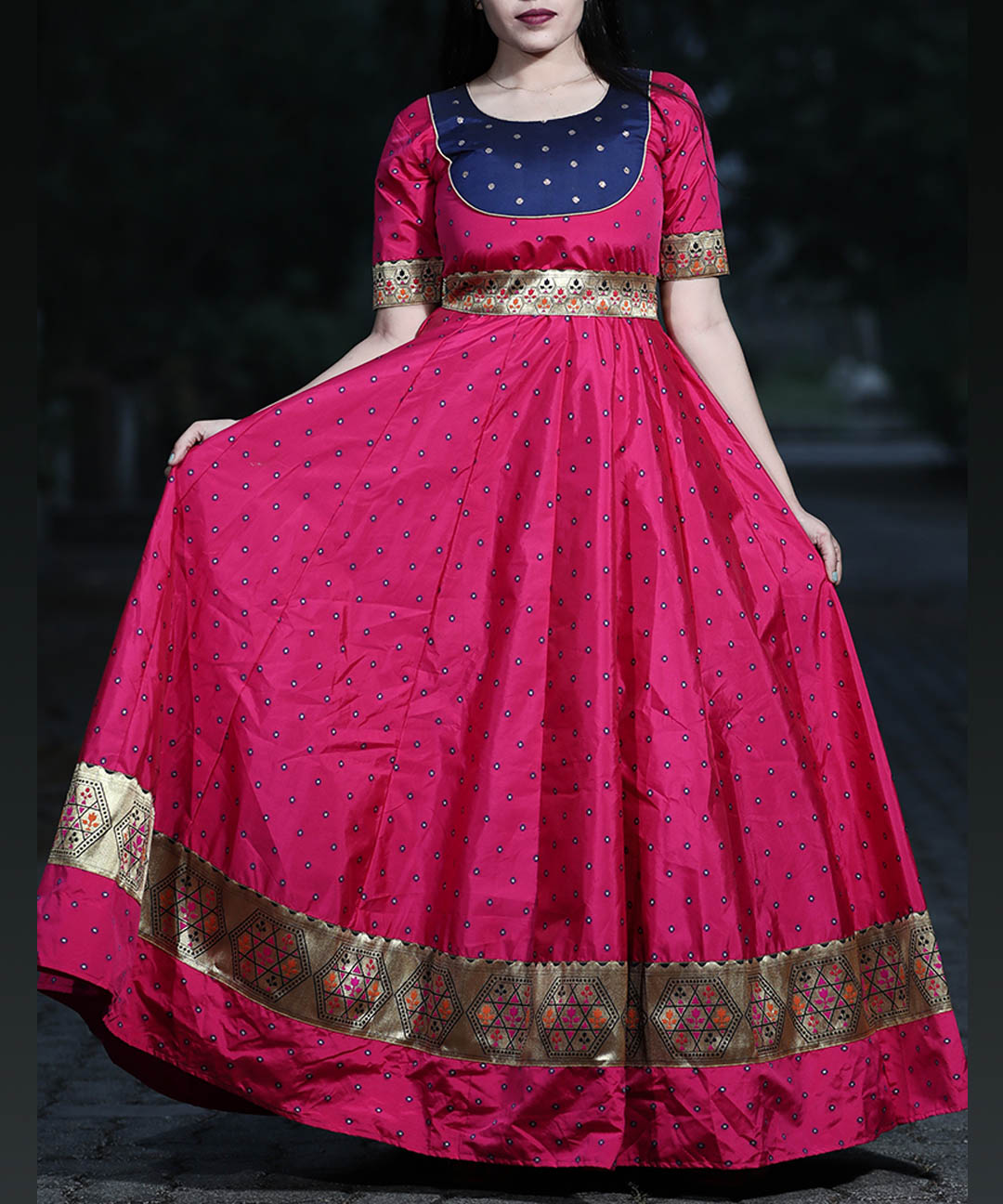 Adorable magenta festive wear gown made of woven taffeta silk, perfect for special occasions.