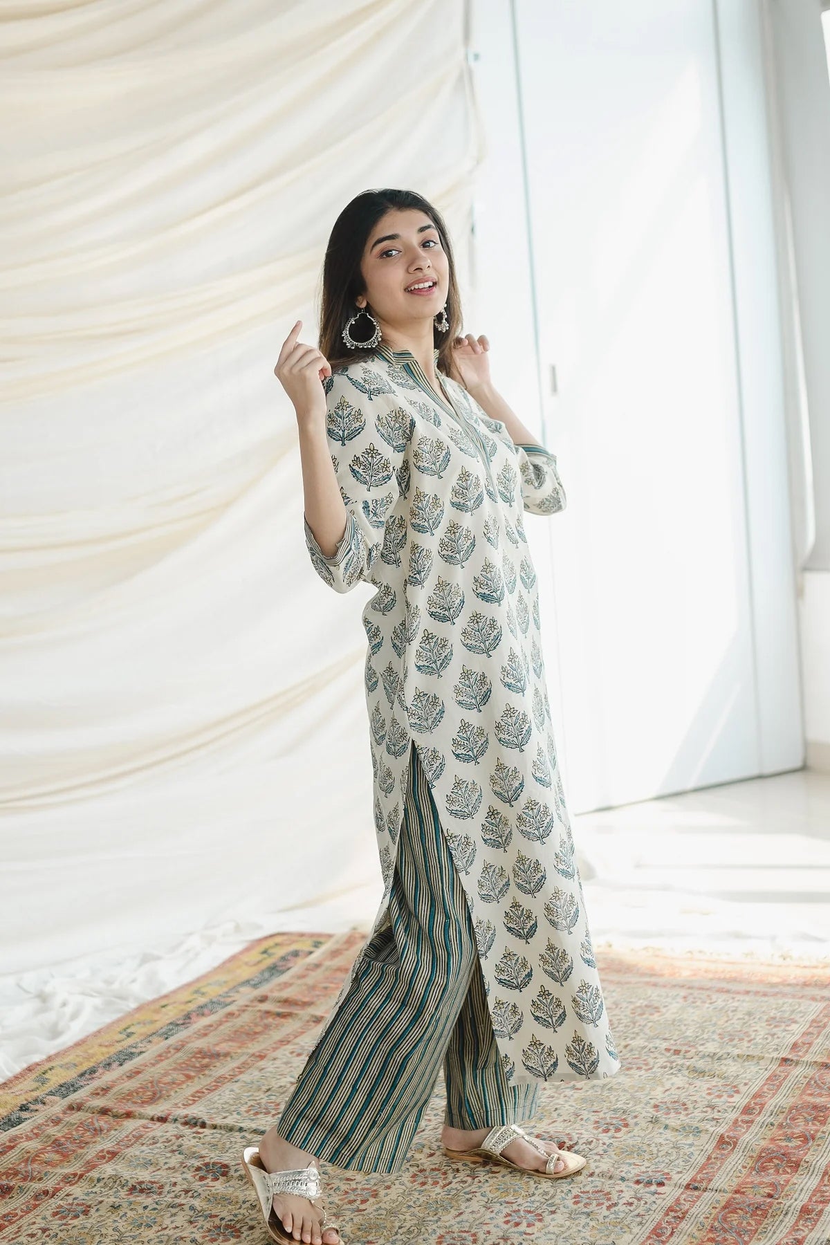 Ajrakh Cotton Kurta Palazzo Set: A comfortable two-piece set featuring a straight kurta and wide-leg palazzo pants, both made from breathable cotton and adorned with traditional Ajrakh block prints.