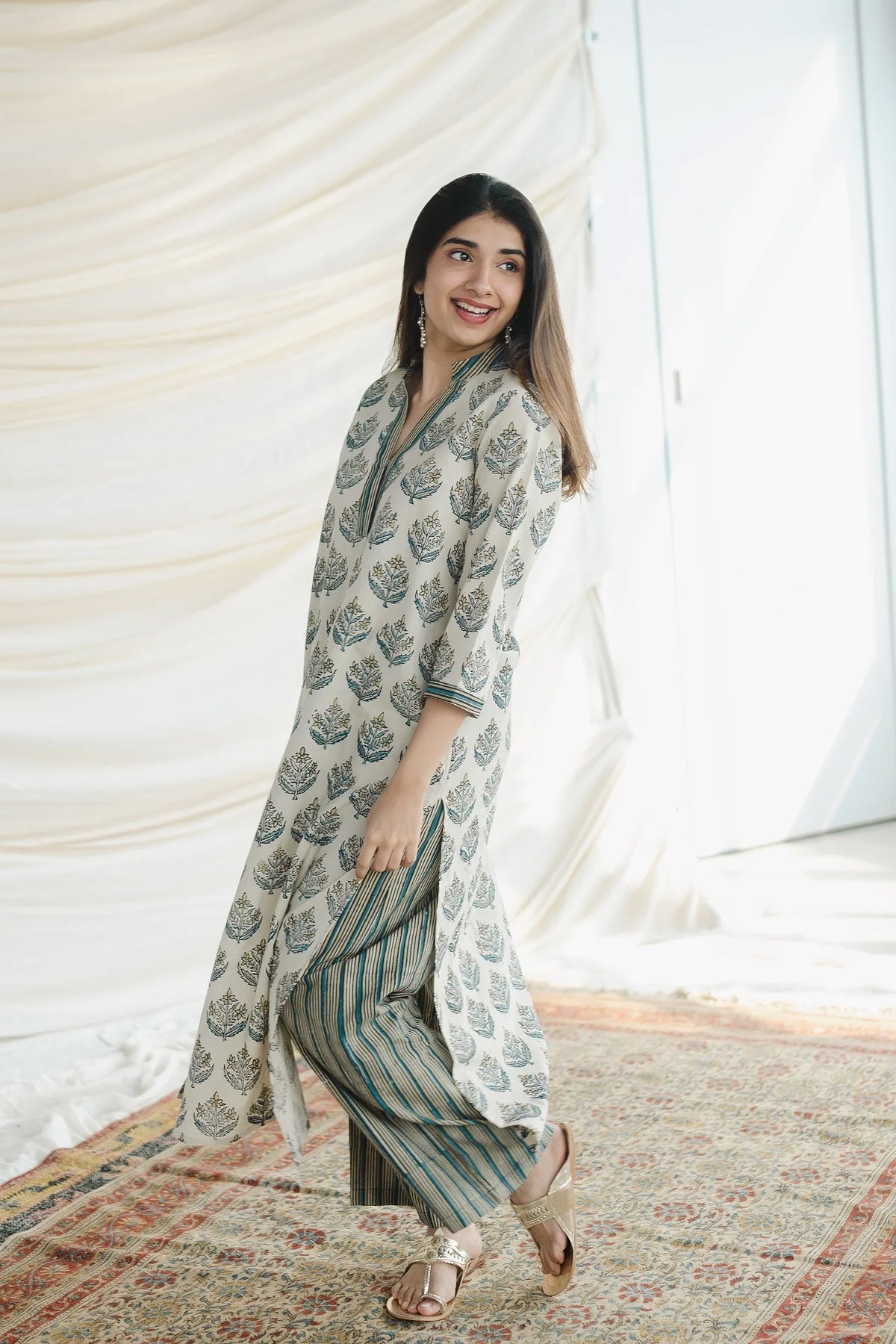 Ajrakh Cotton Kurta Palazzo Set: A comfortable two-piece set featuring a straight kurta and wide-leg palazzo pants, both made from breathable cotton and adorned with traditional Ajrakh block prints.