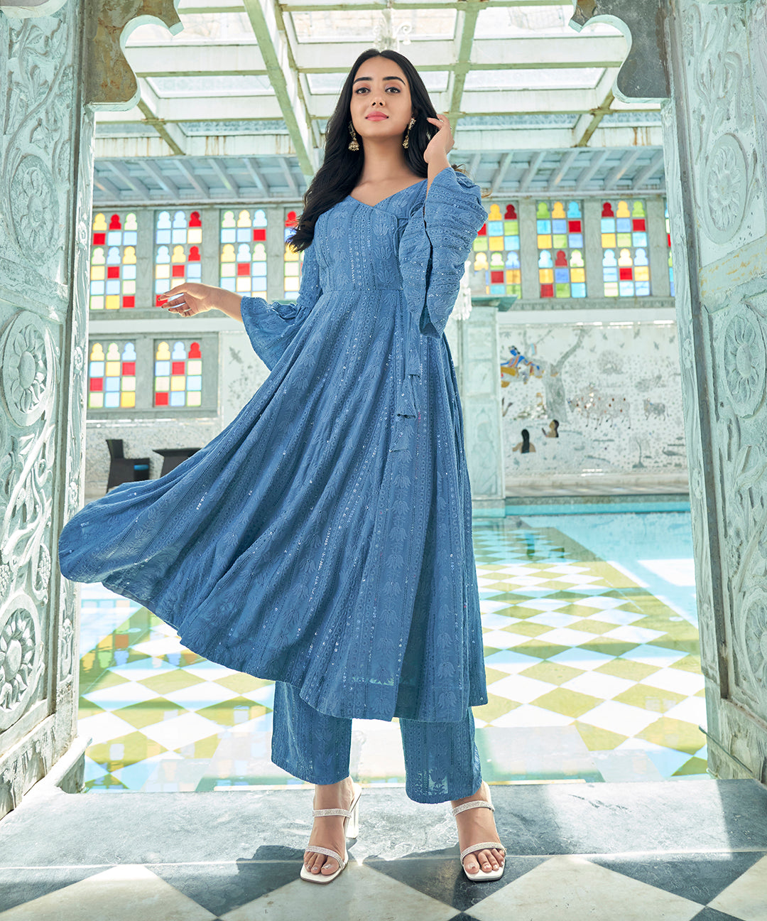 A Baby Blue Rayon Suit Set, combining comfort and elegance with its gentle hue and stylish design.