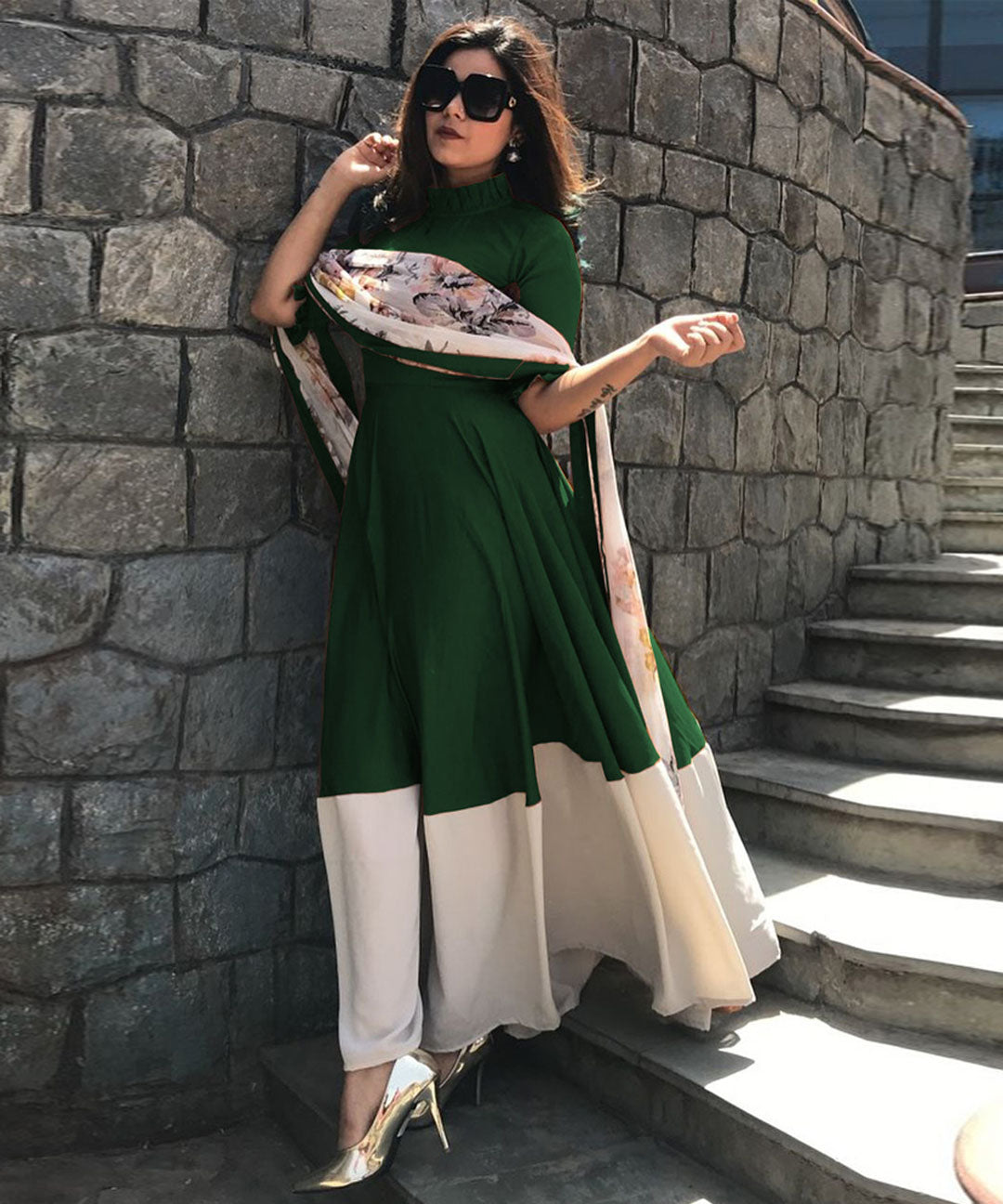 Beautiful dark green partywear rayon gown complemented by a chiffon digital printed dupatta, perfect for festive occasions.
