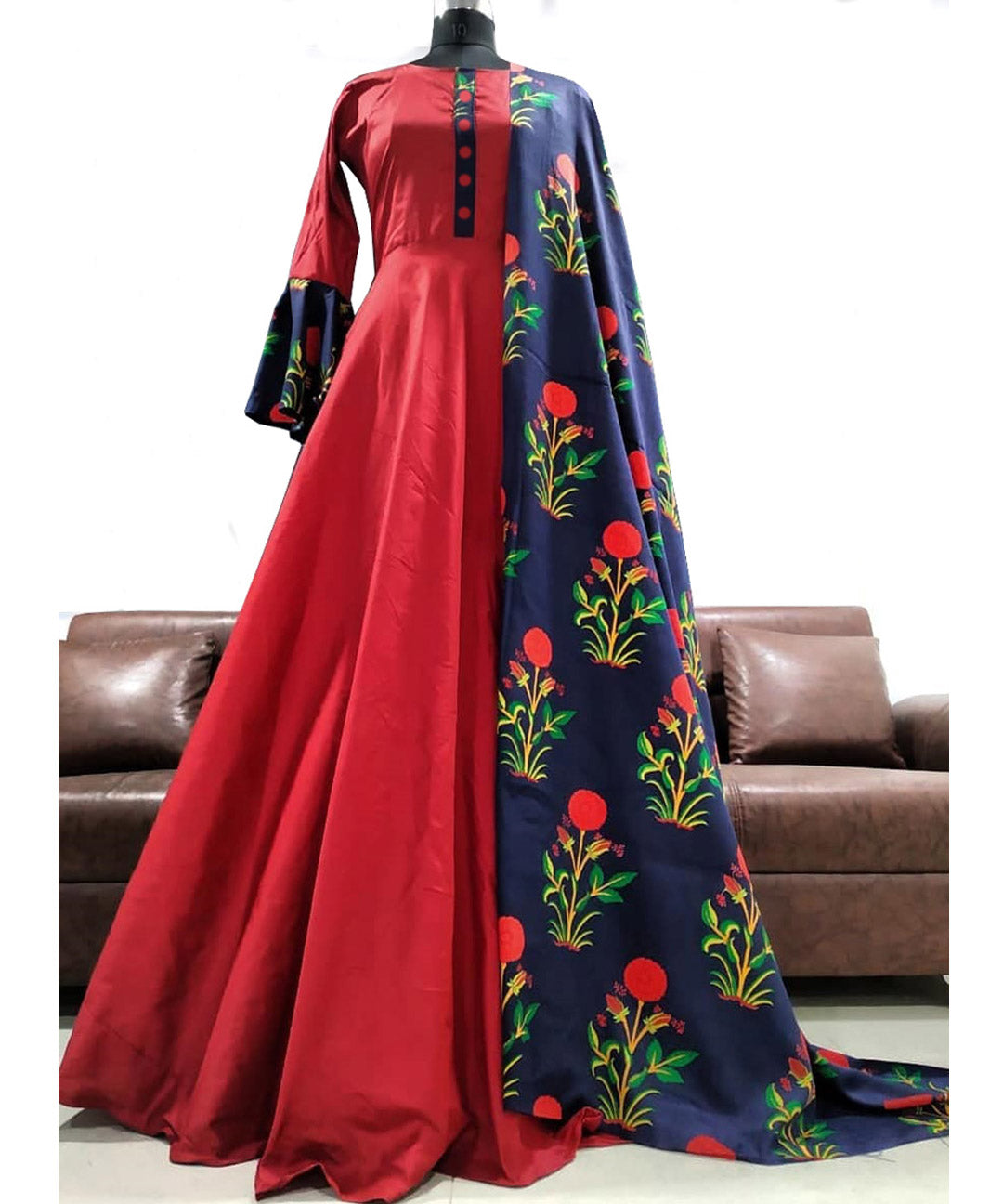 Beckoning hot red designer Tapeta gown with bell sleeves, exuding elegance and style.