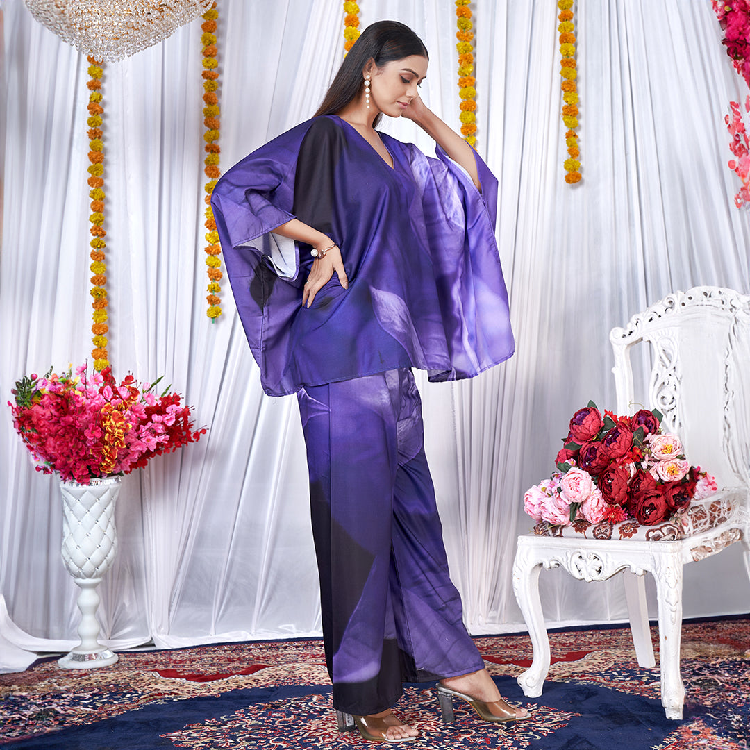 A Berry Blue co-ord set with a kaftan style top and matching bottoms, featuring a leaf print design.