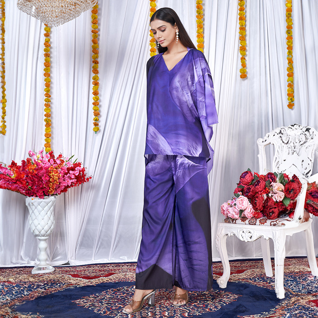 A Berry Blue co-ord set with a kaftan style top and matching bottoms, featuring a leaf print design.