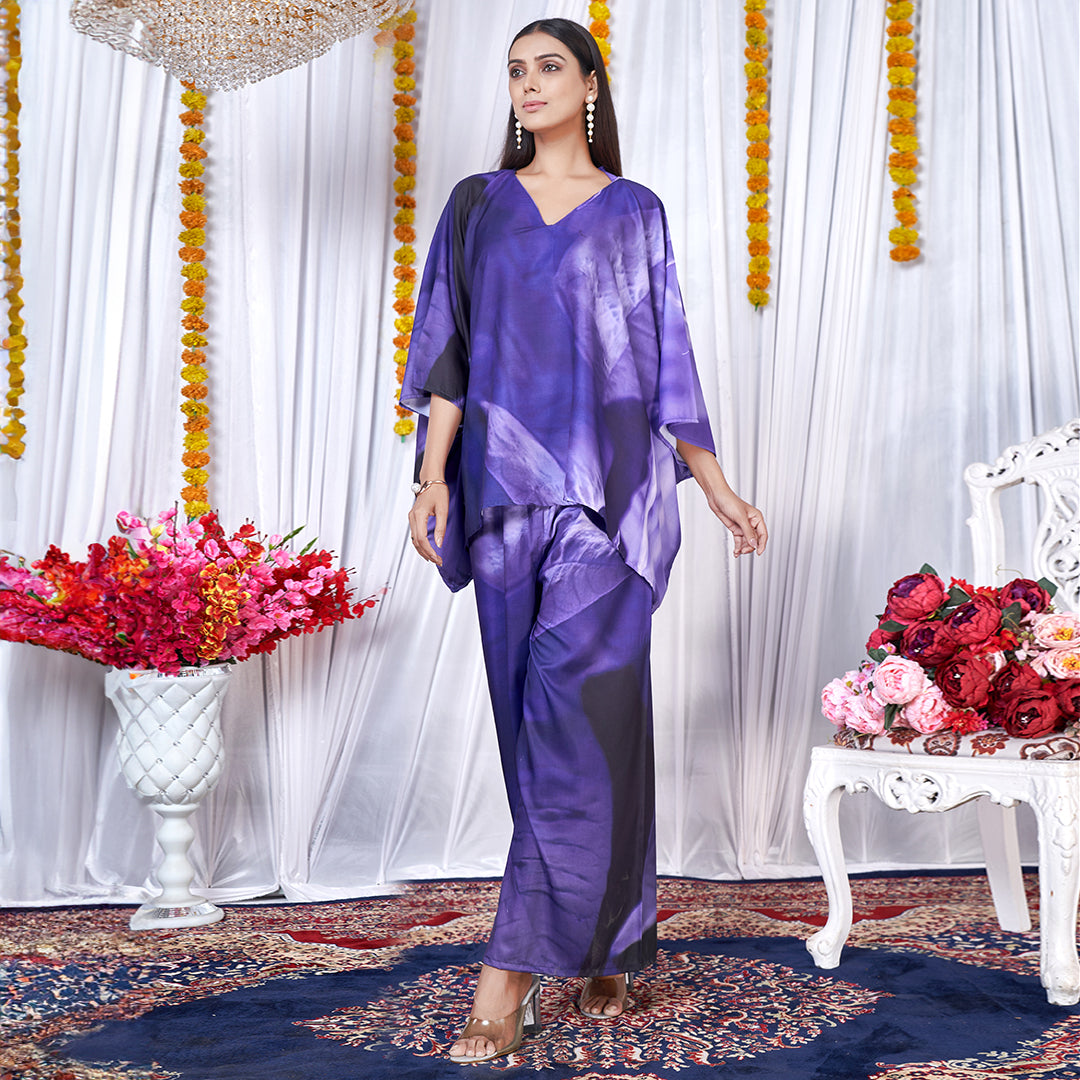 A Berry Blue co-ord set with a kaftan style top and matching bottoms, featuring a leaf print design.