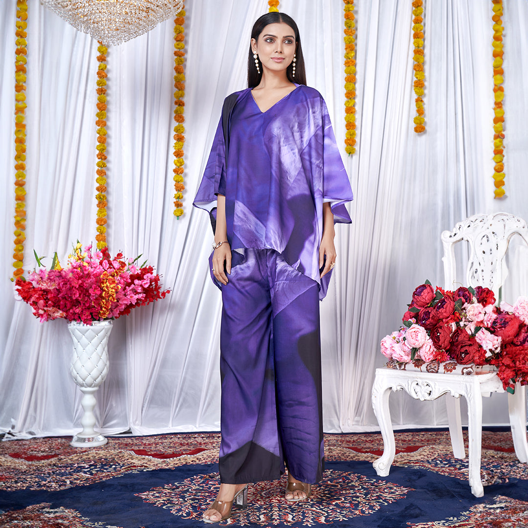 A Berry Blue co-ord set with a kaftan style top and matching bottoms, featuring a leaf print design.