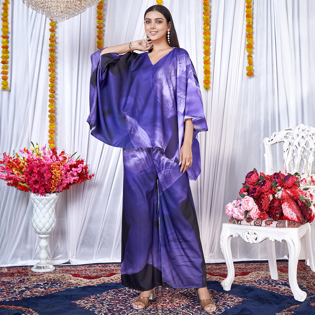 A Berry Blue co-ord set with a kaftan style top and matching bottoms, featuring a leaf print design.