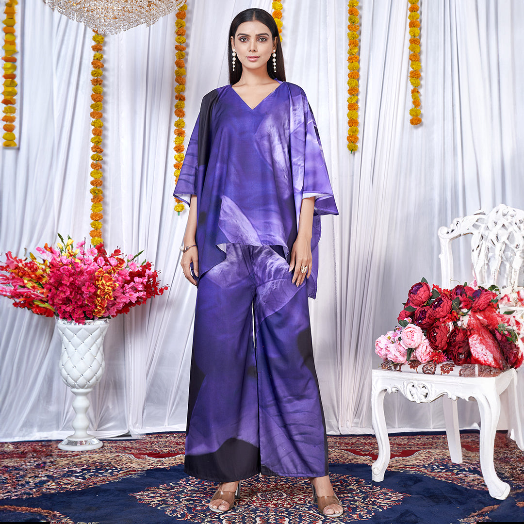 A Berry Blue co-ord set with a kaftan style top and matching bottoms, featuring a leaf print design.