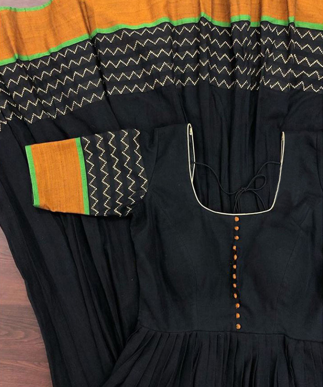 Black colored party wear satin silk gown with trendy printed design, perfect for fashionable occasions.