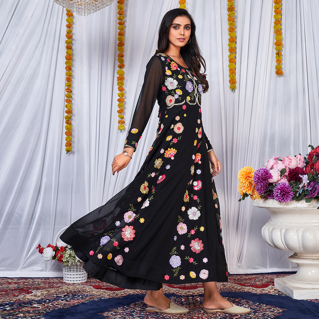 A black Anarkali gown adorned with vibrant multicolor embroidery.