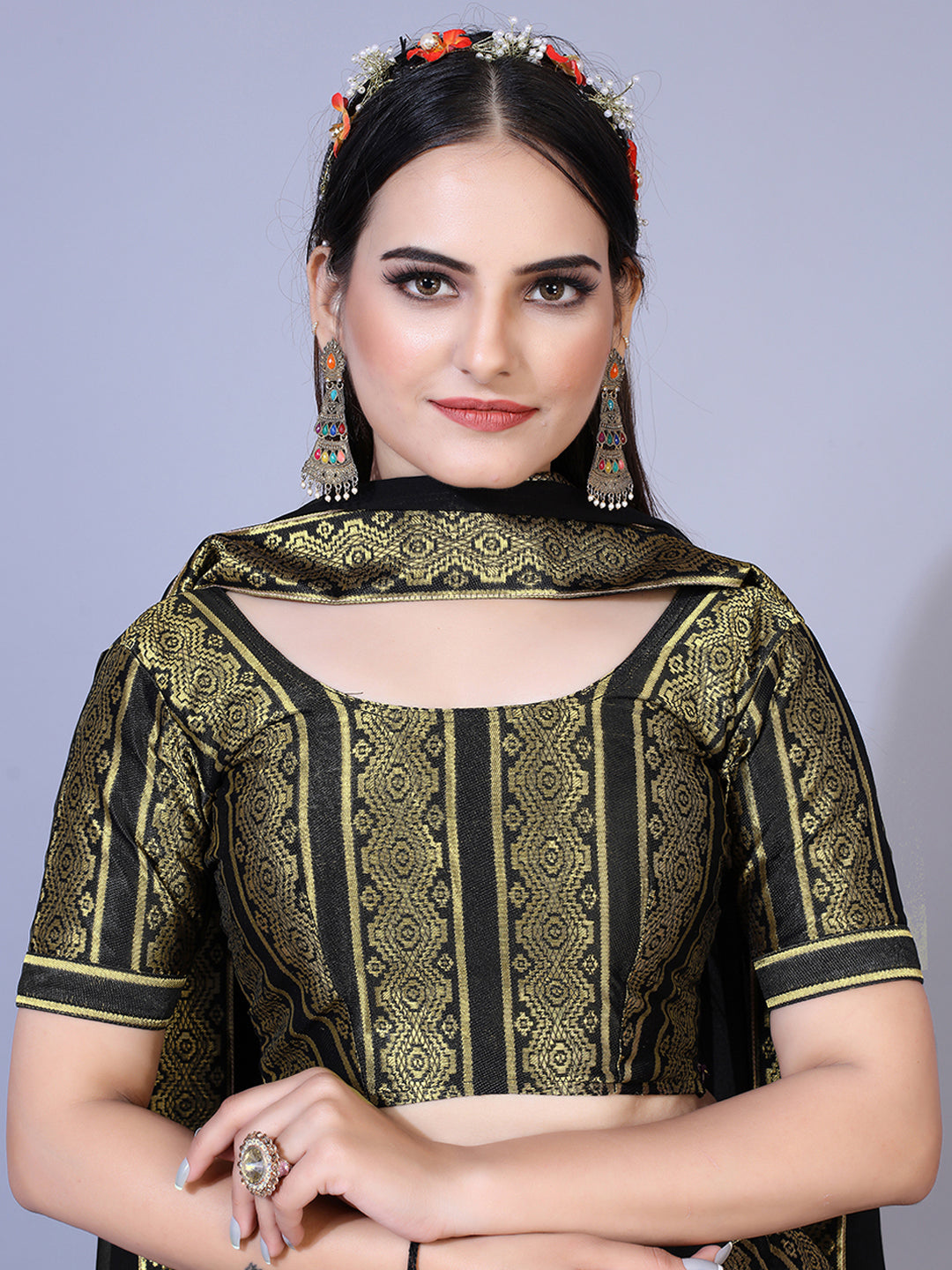 A dramatic black lehenga with a convenient ready-to-wear blouse and a matching dupatta. This complete outfit is perfect for making a statement at your next special occasion.
