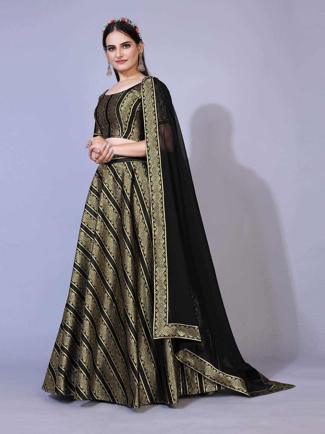 A dramatic black lehenga with a convenient ready-to-wear blouse and a matching dupatta. This complete outfit is perfect for making a statement at your next special occasion.