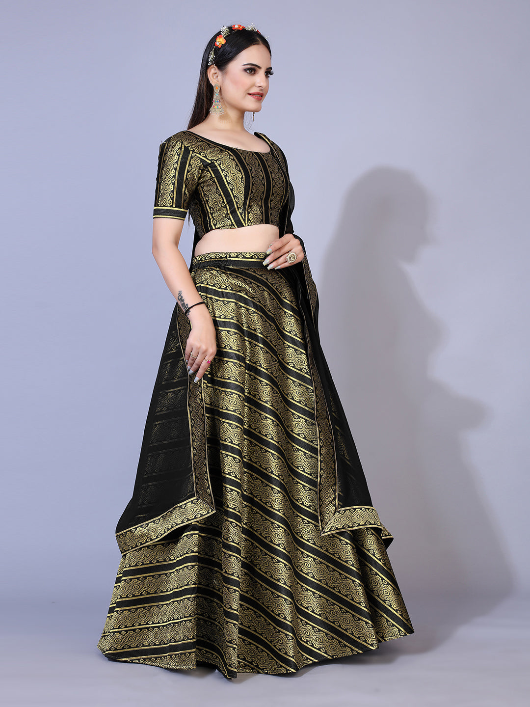 A dramatic black lehenga with a convenient ready-to-wear blouse and a matching dupatta. This complete outfit is perfect for making a statement at your next special occasion.