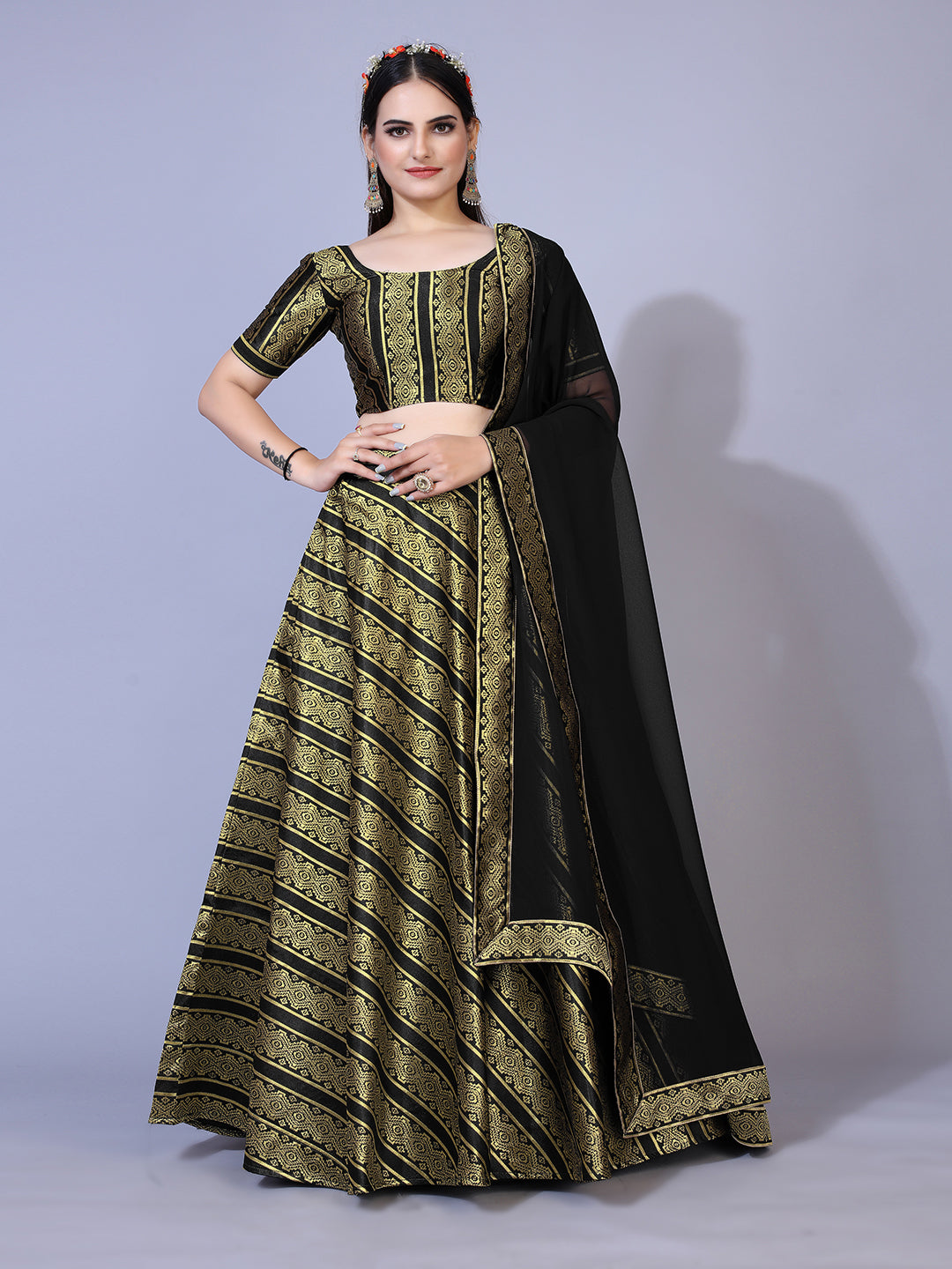 A dramatic black lehenga with a convenient ready-to-wear blouse and a matching dupatta. This complete outfit is perfect for making a statement at your next special occasion.