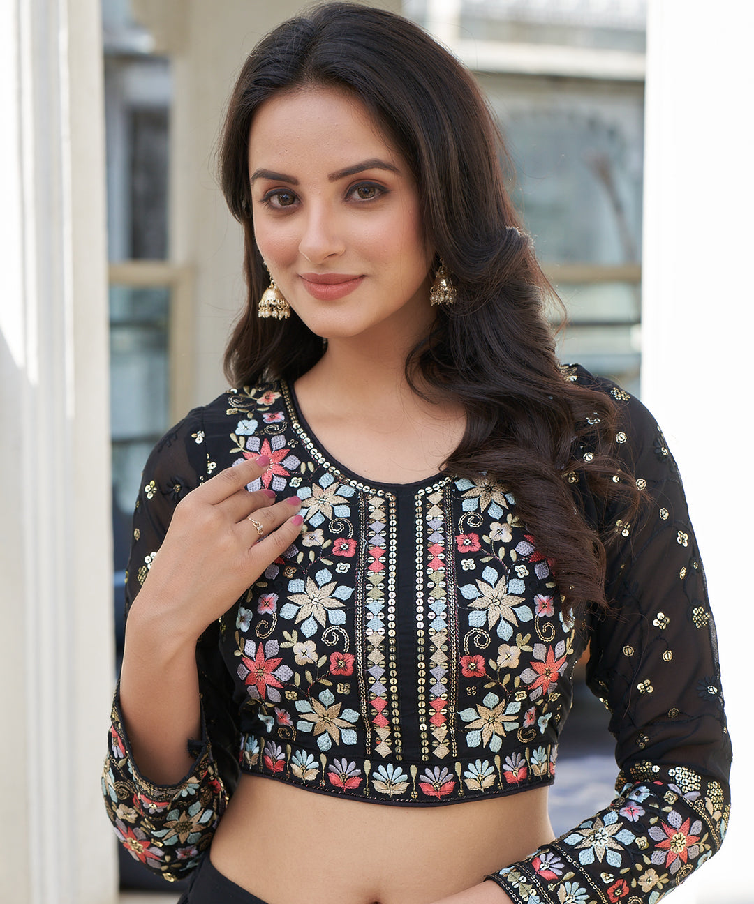 Black tiered lehenga choli with matching dupatta, featuring a stylish layered design and elegant detailing