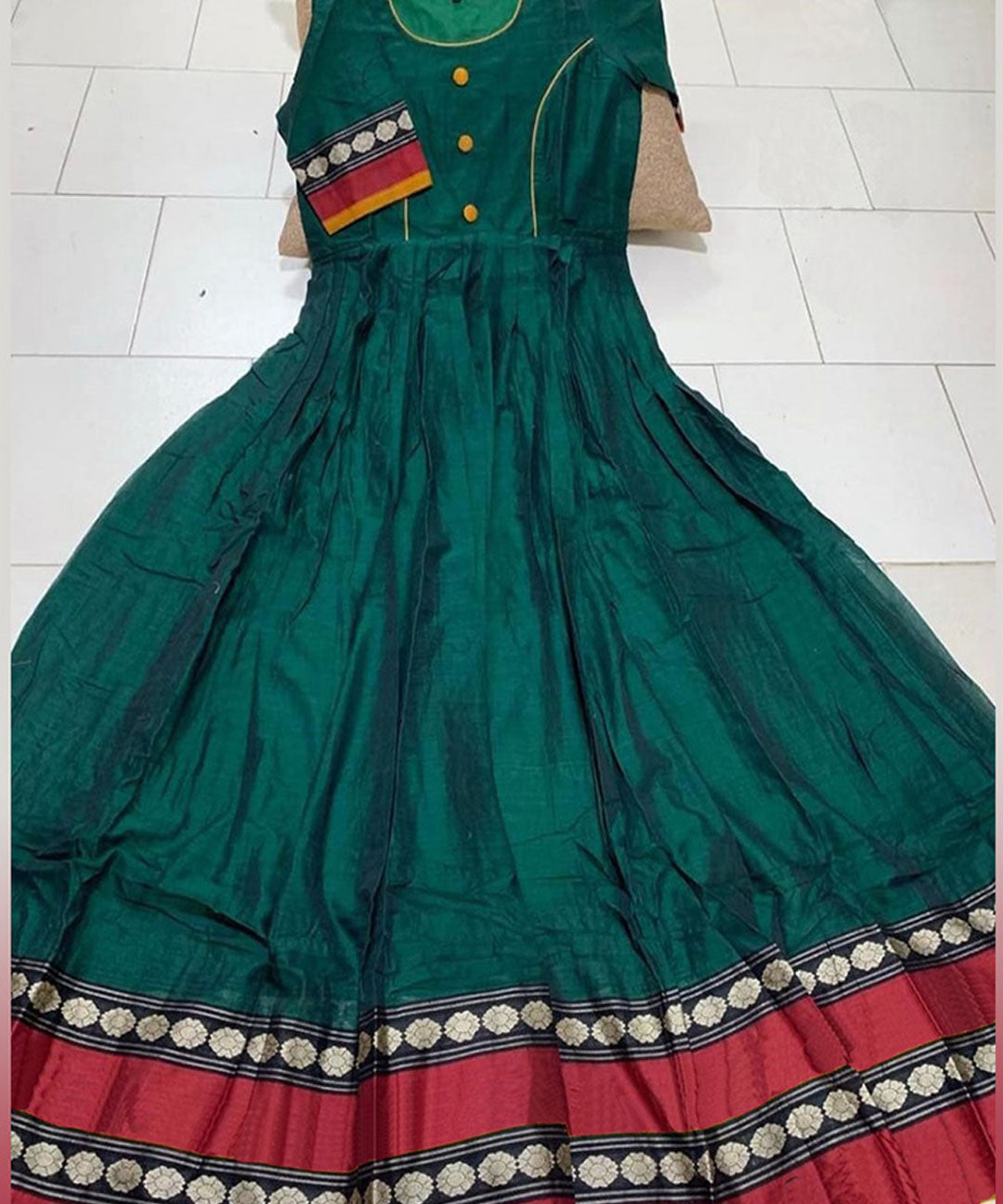 Bottle green colored partywear satin silk gown with trendy print, perfect for stylish occasions.
