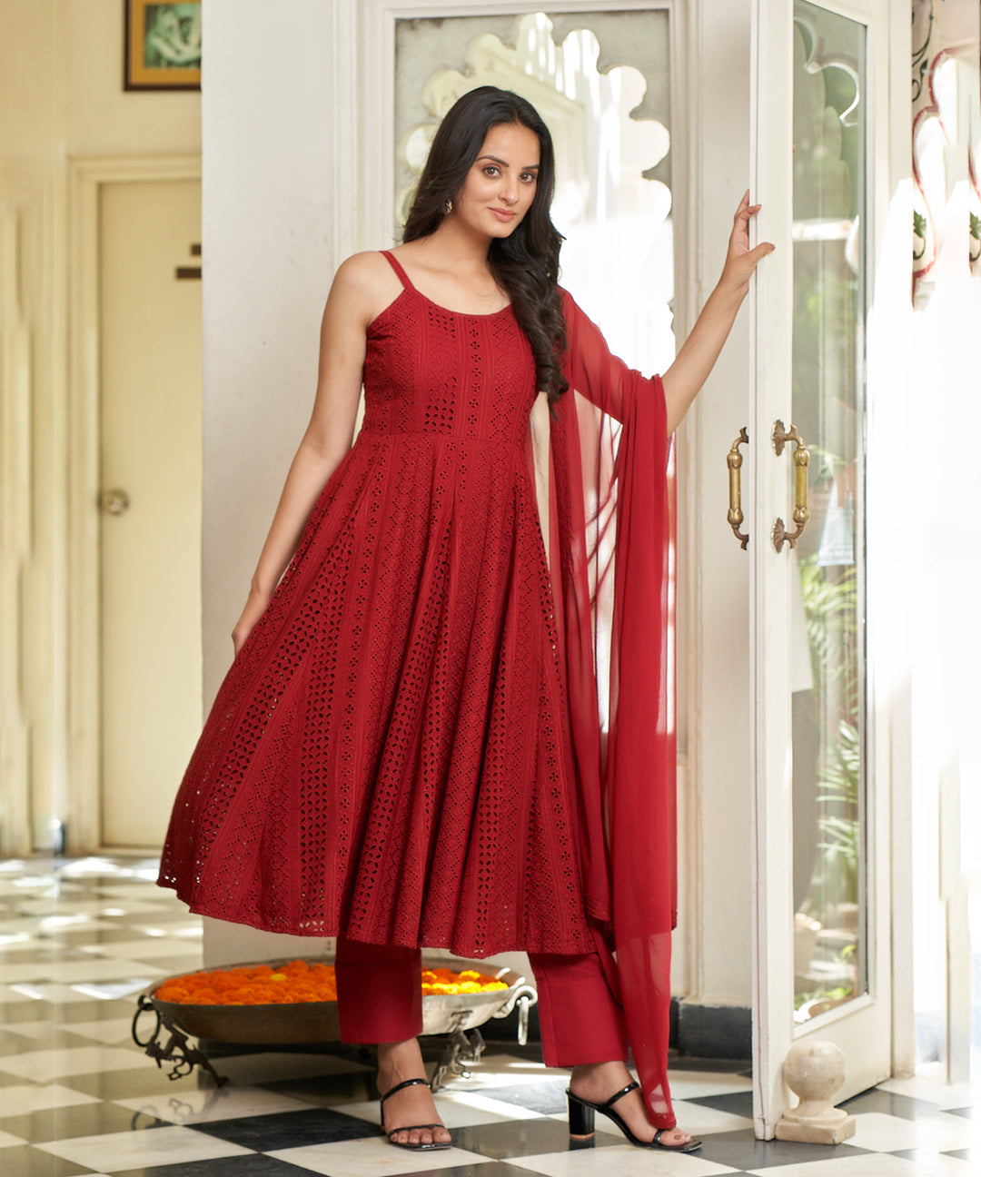 Carmine red Anarkali suit set featuring a rich color and elegant design