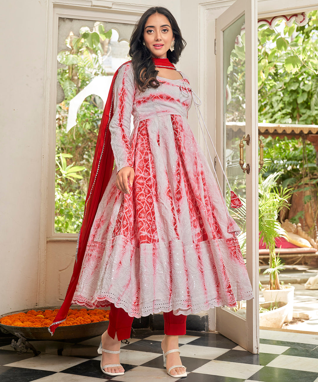 A stunning Cherry Red Chikankari Suit Set, featuring intricate chikankari embroidery for a vibrant and elegant look.