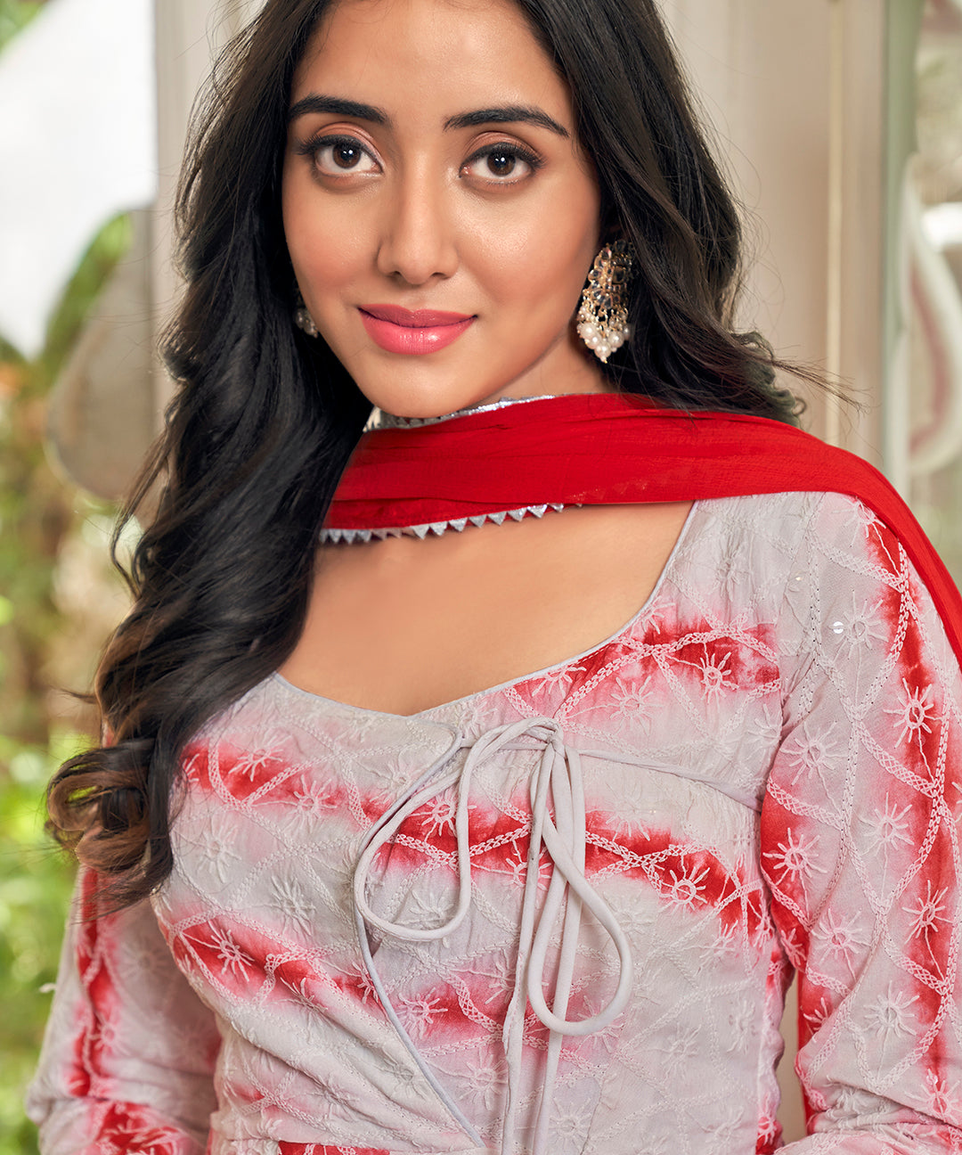 A stunning Cherry Red Chikankari Suit Set, featuring intricate chikankari embroidery for a vibrant and elegant look.