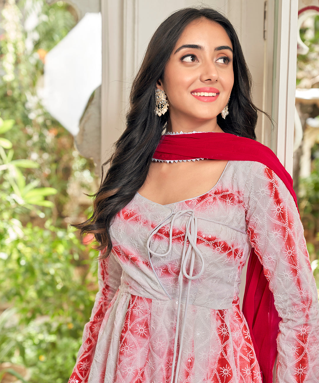 A stunning Cherry Red Chikankari Suit Set, featuring intricate chikankari embroidery for a vibrant and elegant look.