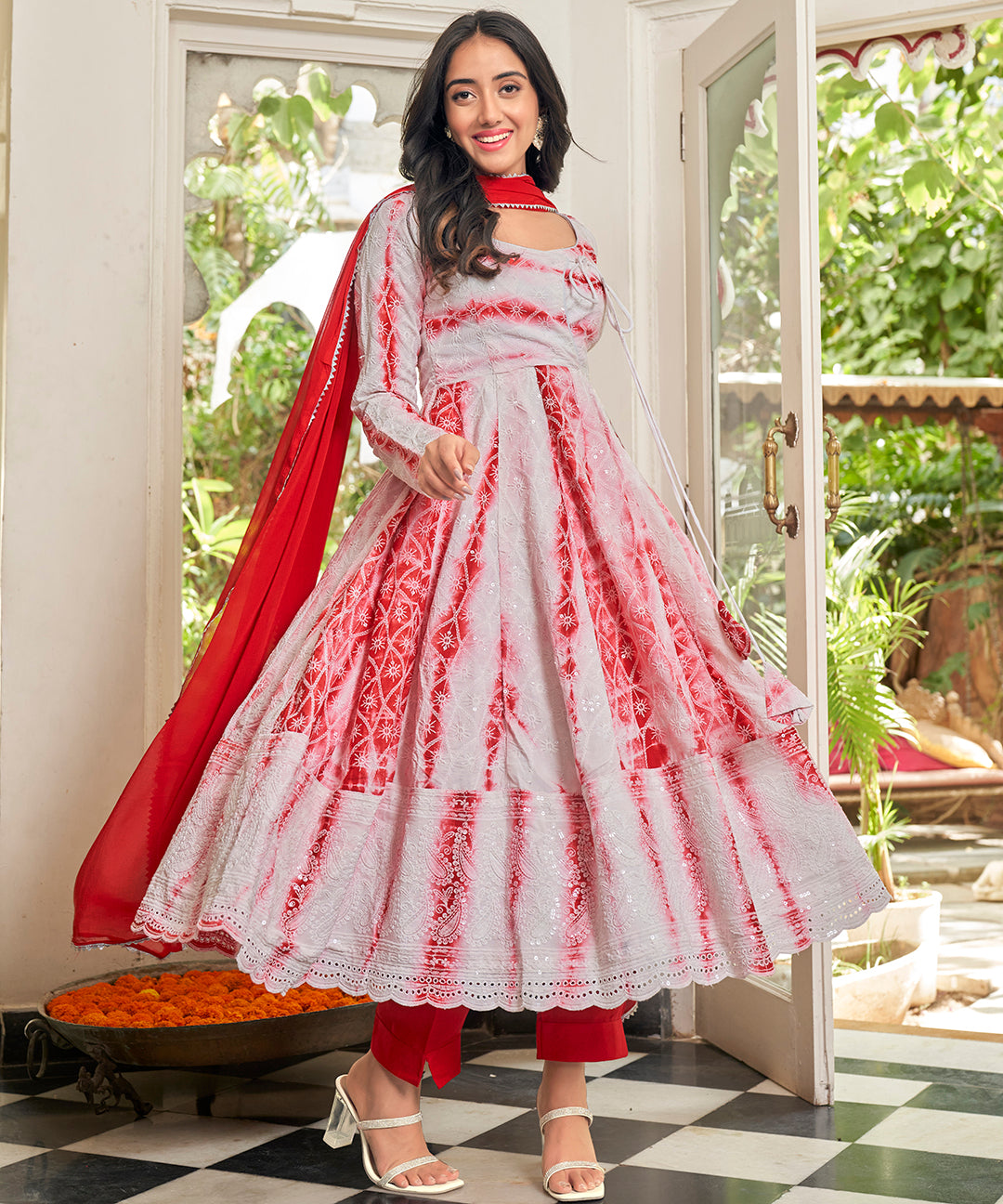 A stunning Cherry Red Chikankari Suit Set, featuring intricate chikankari embroidery for a vibrant and elegant look.