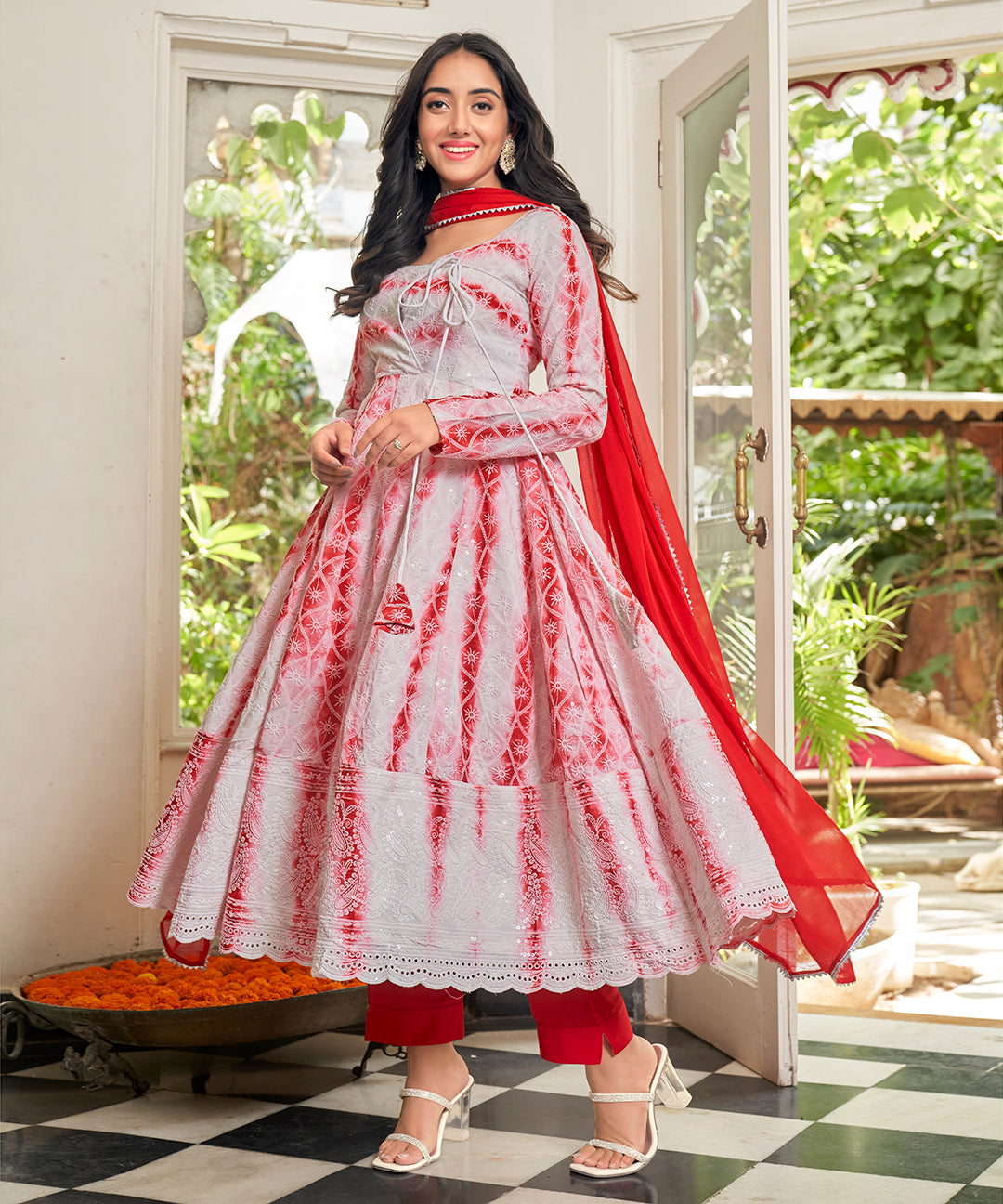 A stunning Cherry Red Chikankari Suit Set, featuring intricate chikankari embroidery for a vibrant and elegant look.