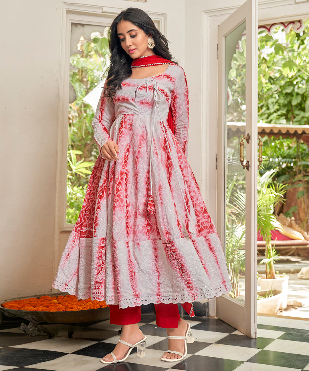 A stunning Cherry Red Chikankari Suit Set, featuring intricate chikankari embroidery for a vibrant and elegant look.