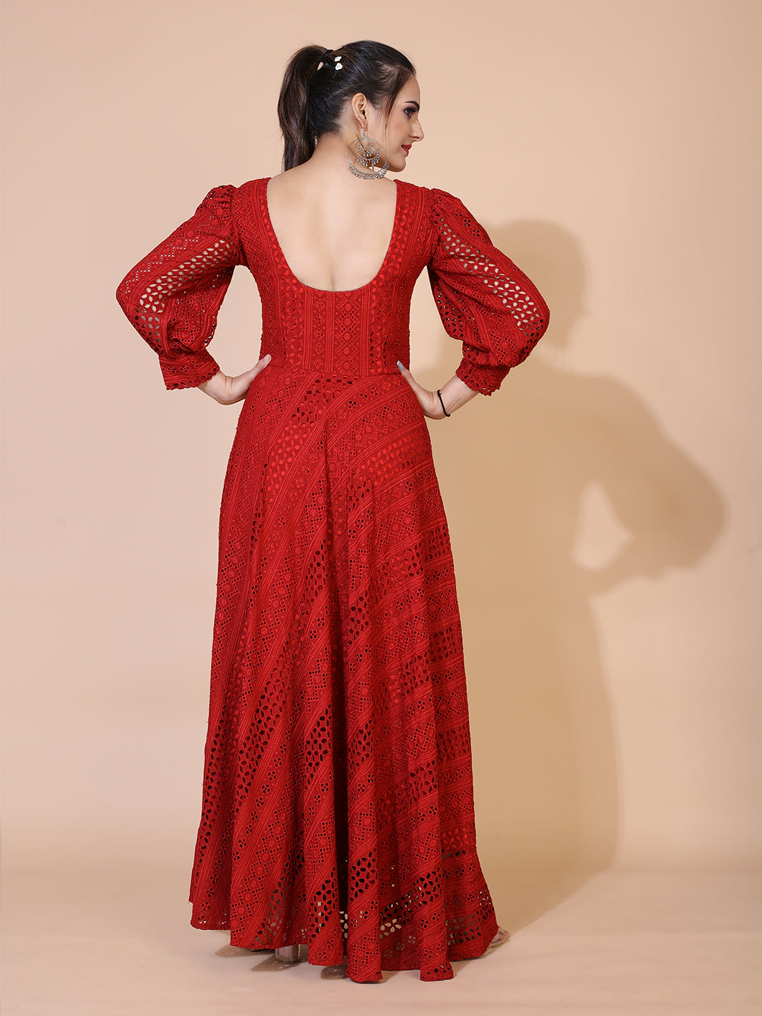 A timeless maroon gown adorned with traditional Lucknowi embroidery, featuring a graceful floor-length silhouette.