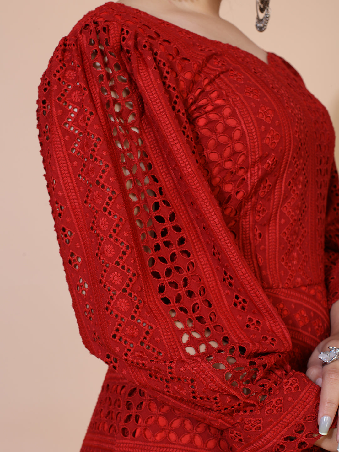 A timeless maroon gown adorned with traditional Lucknowi embroidery, featuring a graceful floor-length silhouette.