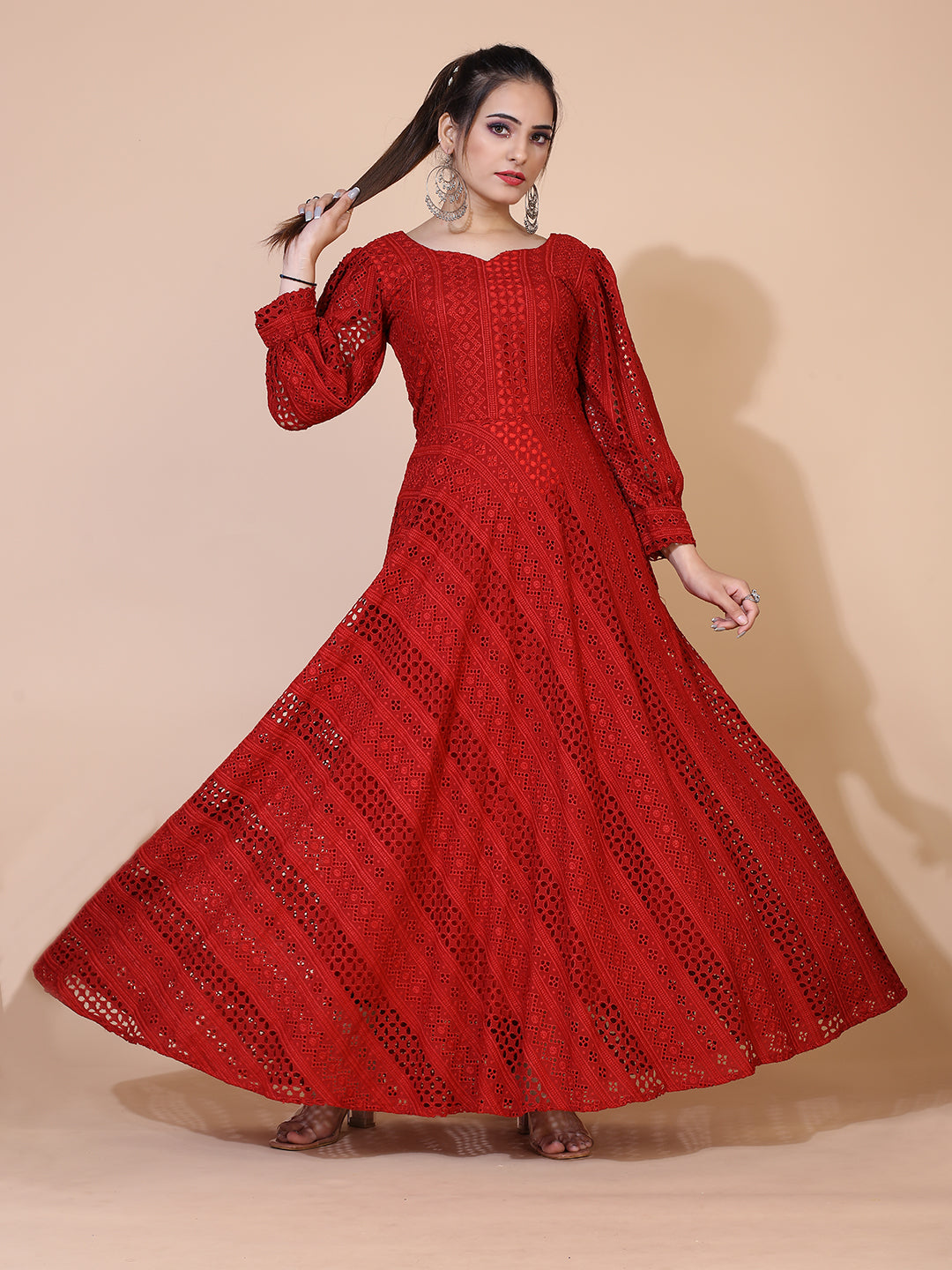 A timeless maroon gown adorned with traditional Lucknowi embroidery, featuring a graceful floor-length silhouette.