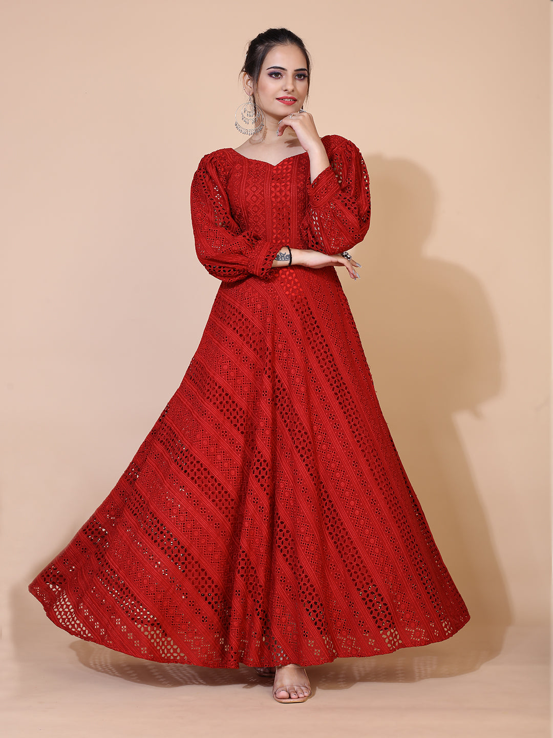 A timeless maroon gown adorned with traditional Lucknowi embroidery, featuring a graceful floor-length silhouette.