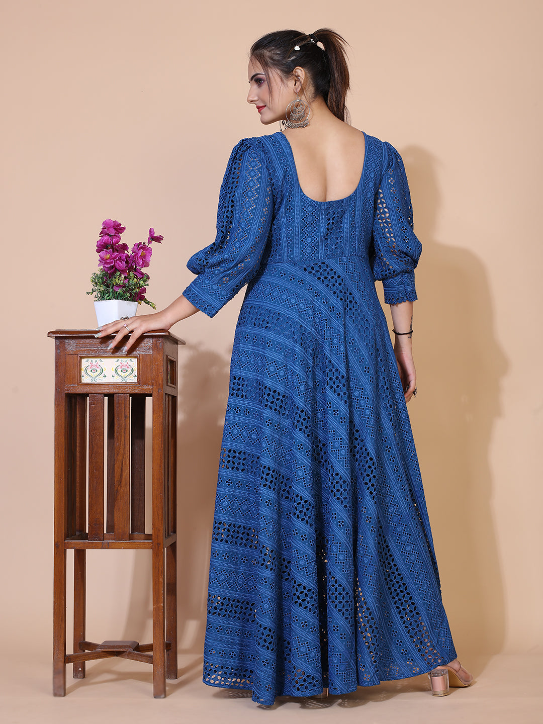 Classic turquoise blue Lucknowi embroidered gown with a flowing floor-length silhouette.