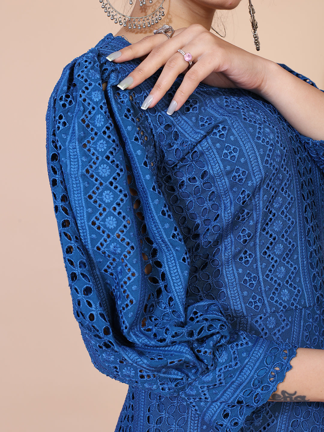 Classic turquoise blue Lucknowi embroidered gown with a flowing floor-length silhouette.