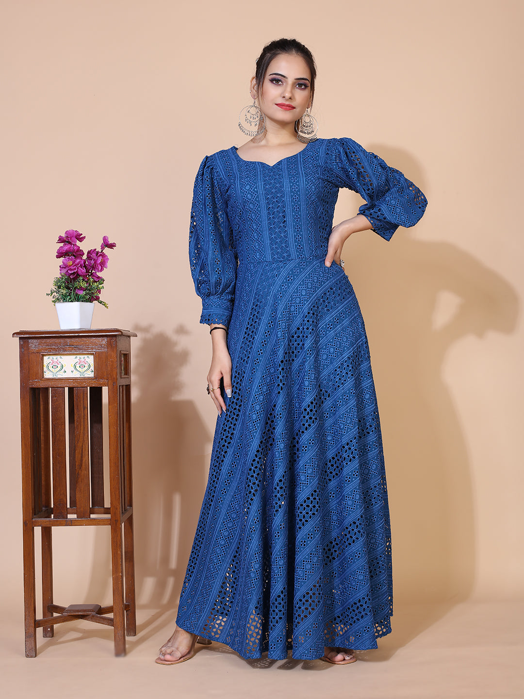 Classic turquoise blue Lucknowi embroidered gown with a flowing floor-length silhouette.