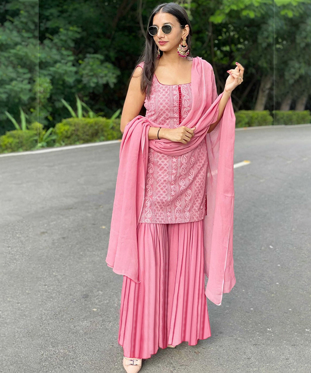 Designer pink Georgette sharara suit adorned with intricate Lucknowi embroidery, showcasing elegance and style