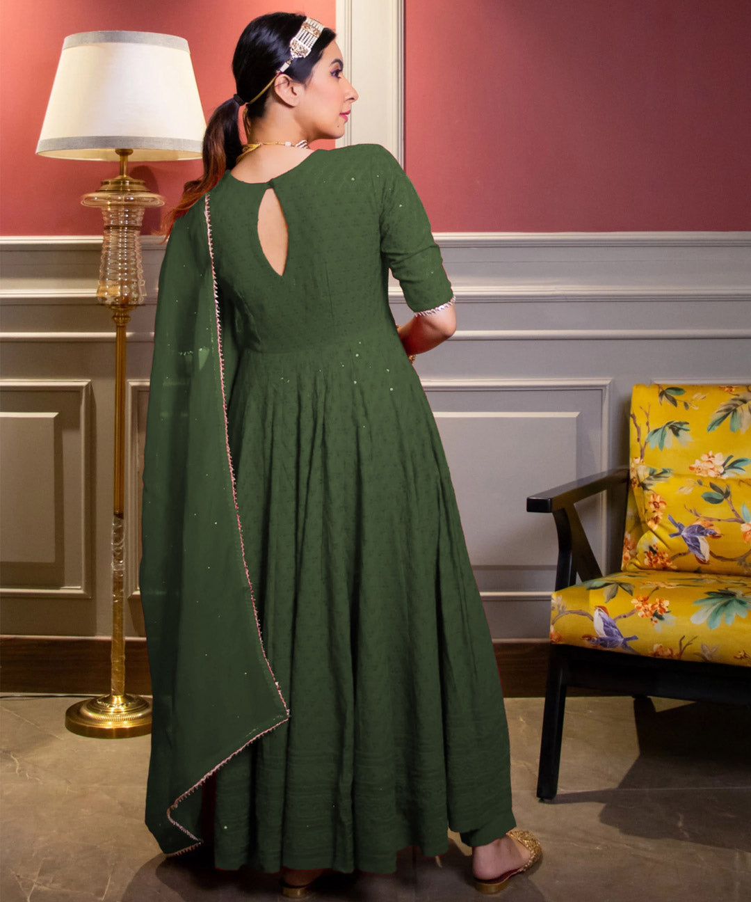 Green Chikankari Anarkali suit set with intricate embroidery, perfect for traditional and festive occasions.