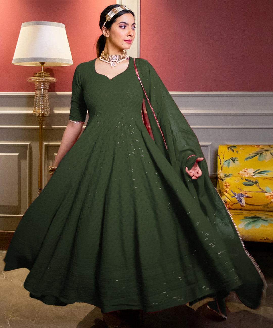 Green Chikankari Anarkali suit set with intricate embroidery, perfect for traditional and festive occasions.