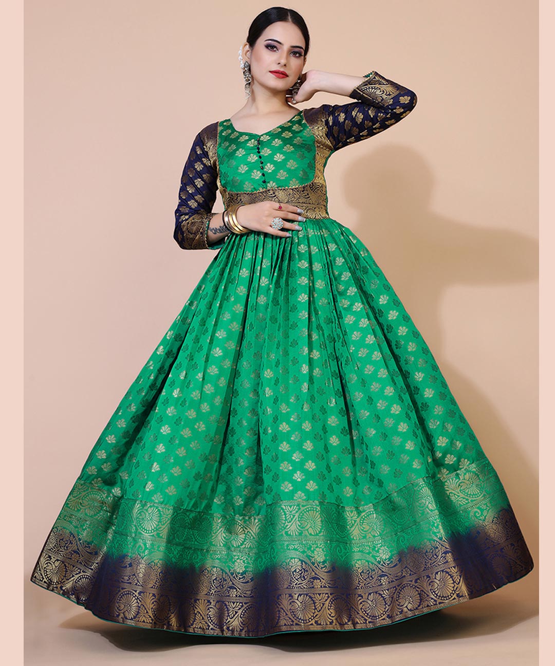 Green jacquard maxi dress adorned with ethnic motifs, ideal for cultural and festive occasions.