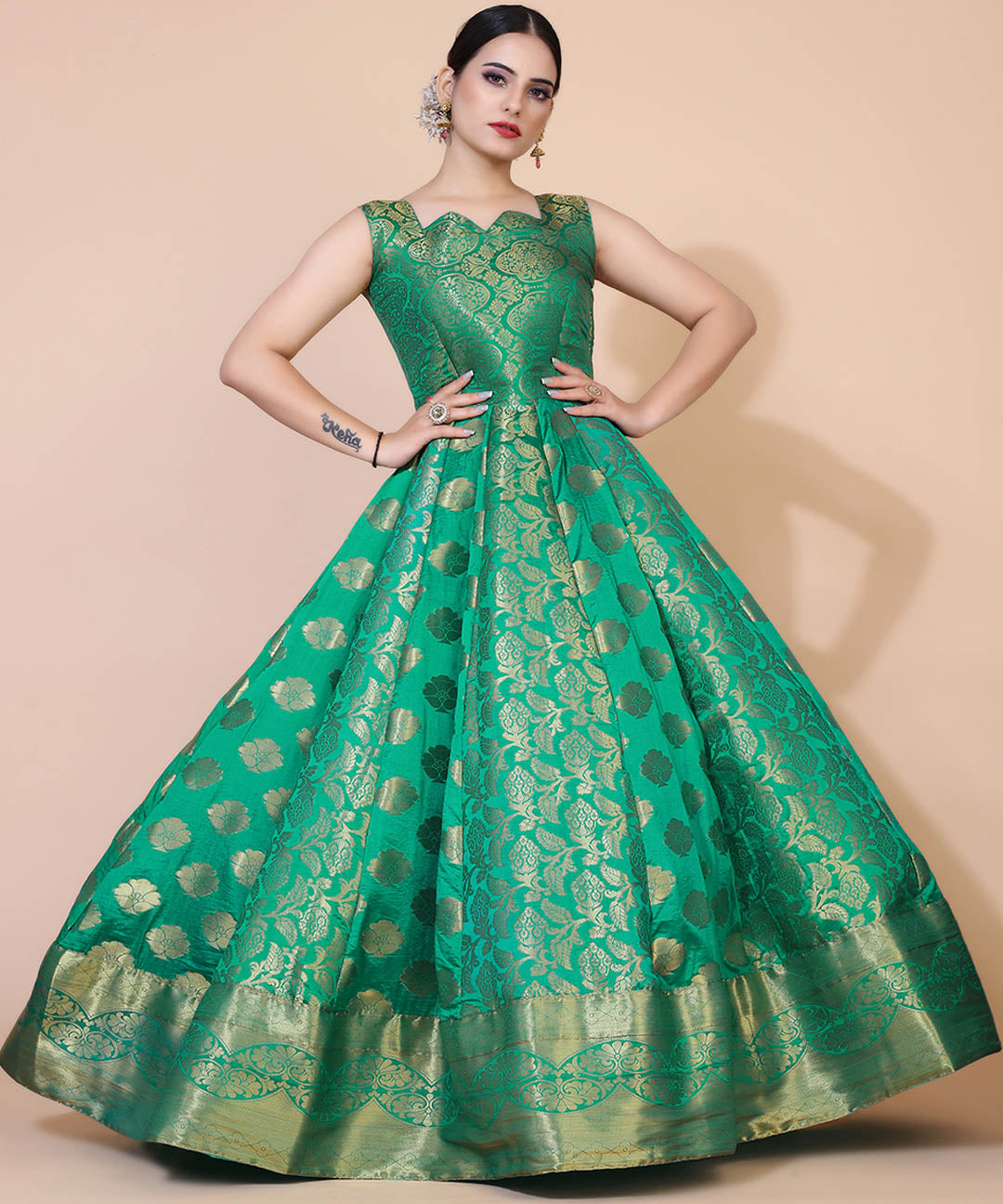 Green jacquard maxi dress adorned with ethnic motifs, ideal for cultural and festive occasions.