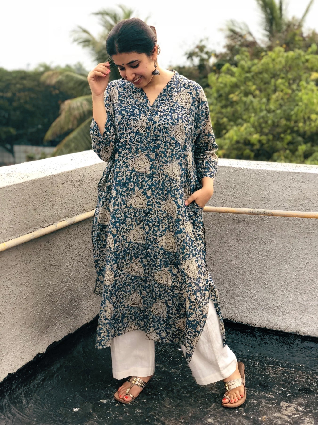 Indigo Kalamkari Kurta with Comfy Palazzos: A two-piece set featuring a long indigo kurta with beautiful Kalamkari prints and comfortable elasticated palazzo pants, both made from breathable cotton.