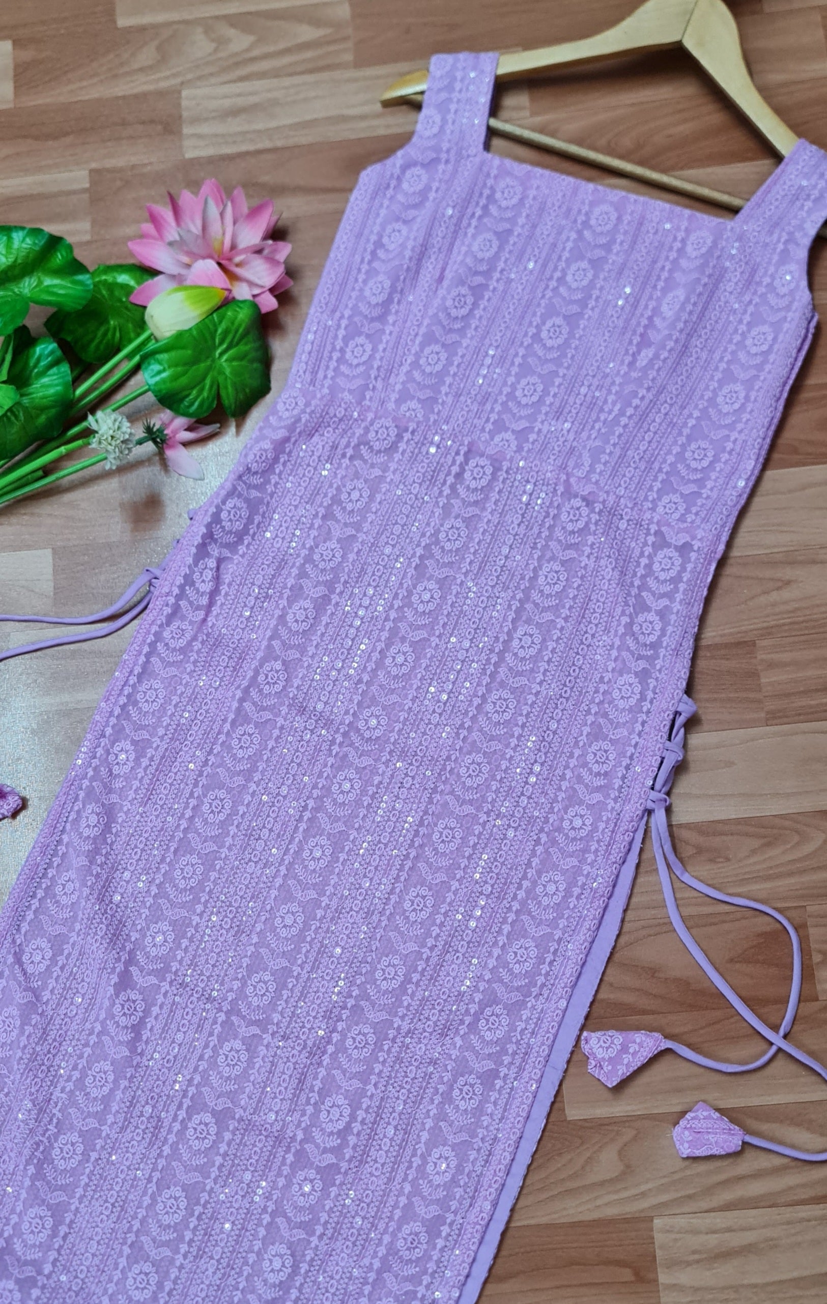 Lavender Chikankari Kurti with Tassels: A long, lavender kurti featuring intricate Chikankari embroidery and delicate side tassels.