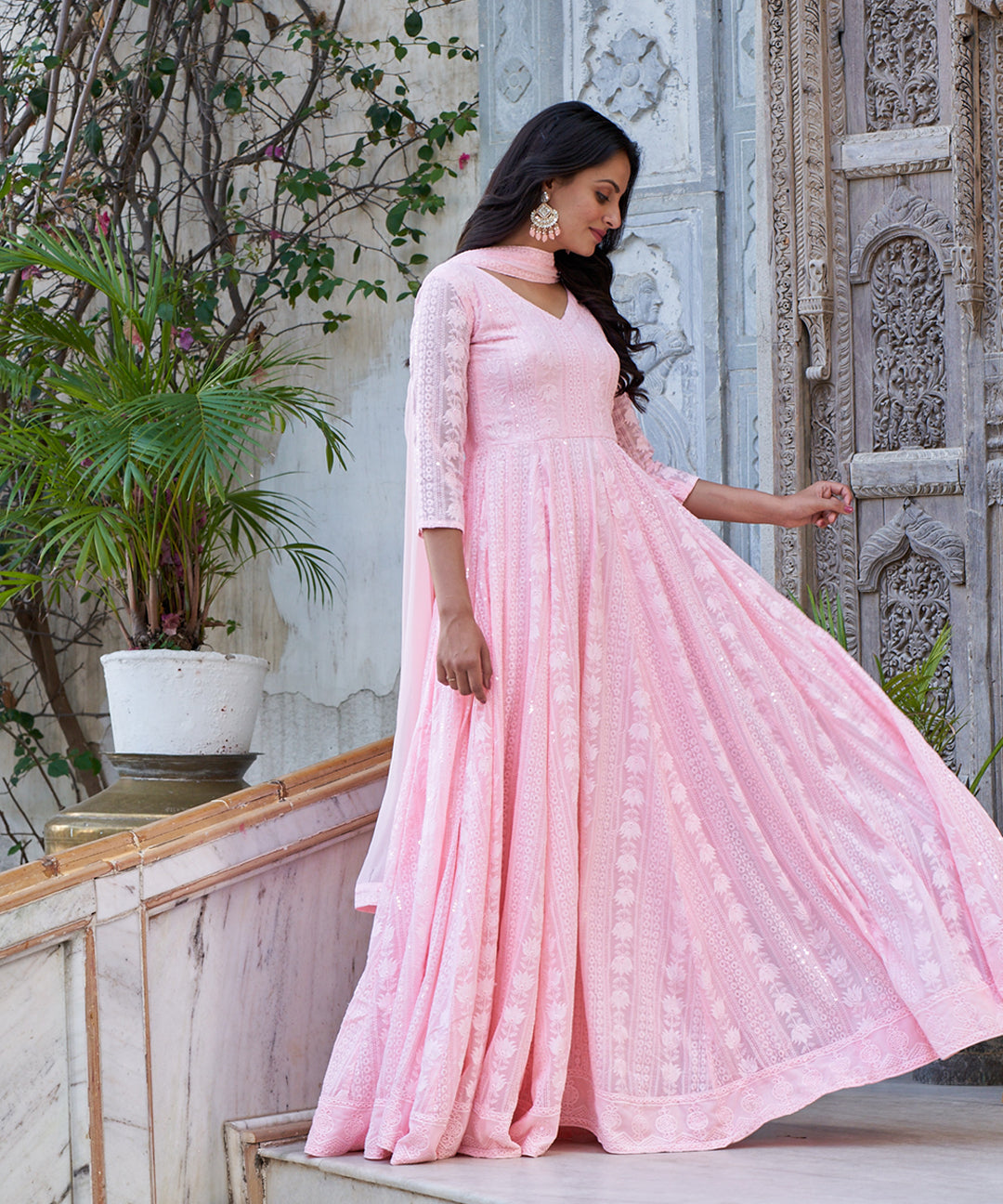 Light pink Lucknowi embroidered Georgette Anarkali suit featuring intricate detailing and a graceful design