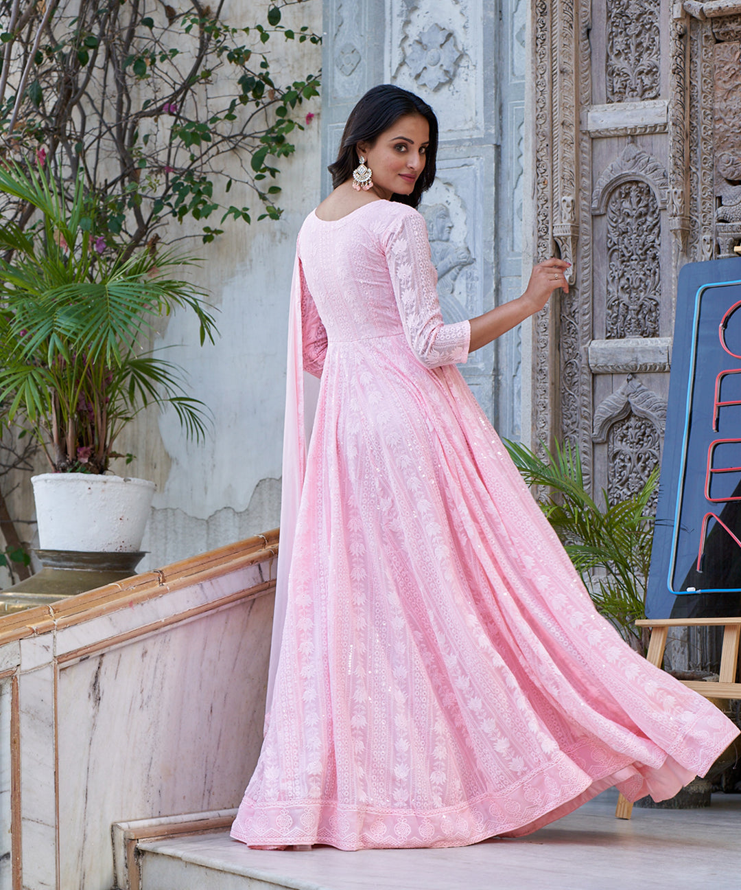 Light pink Lucknowi embroidered Georgette Anarkali suit featuring intricate detailing and a graceful design