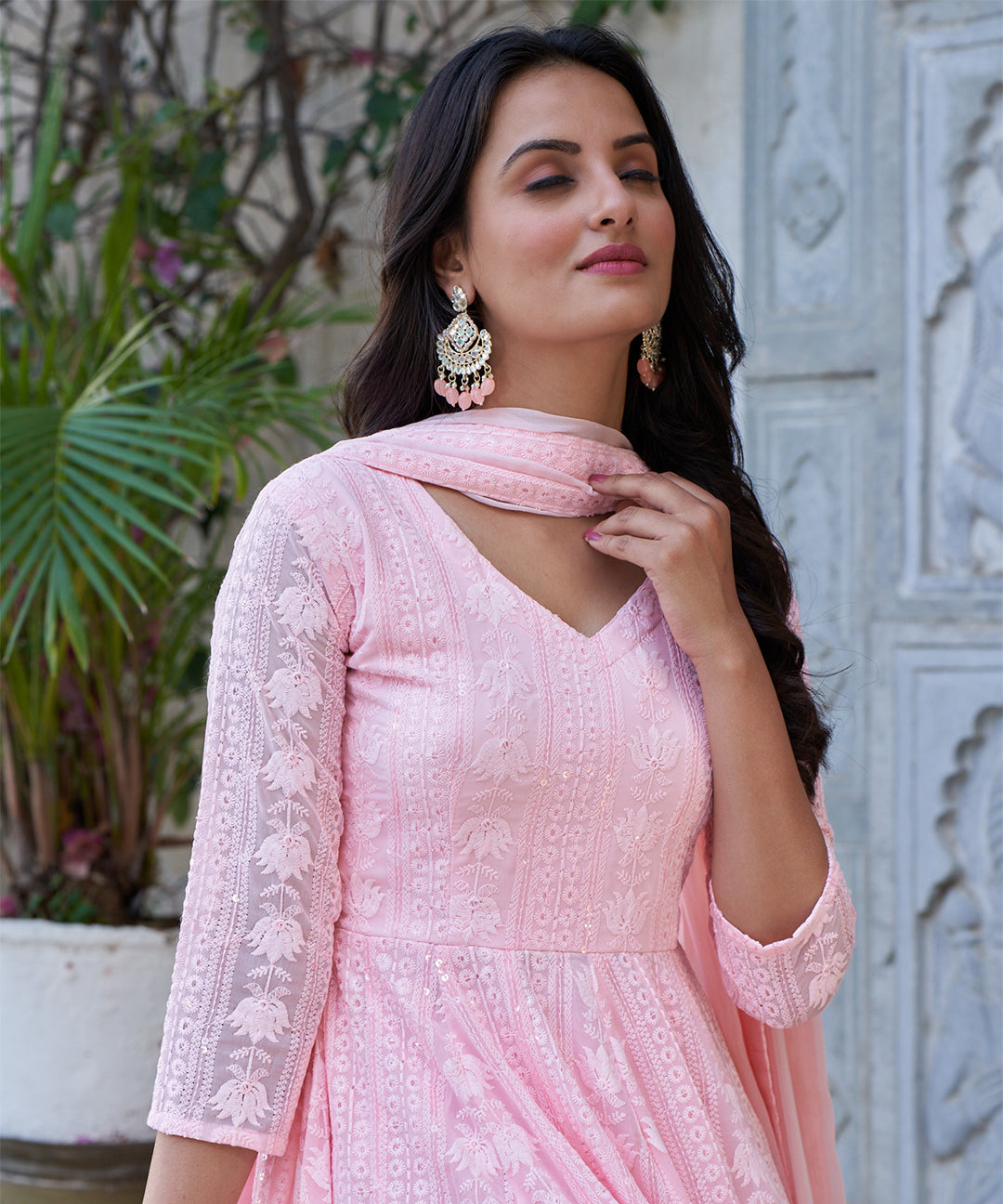 Light pink Lucknowi embroidered Georgette Anarkali suit featuring intricate detailing and a graceful design