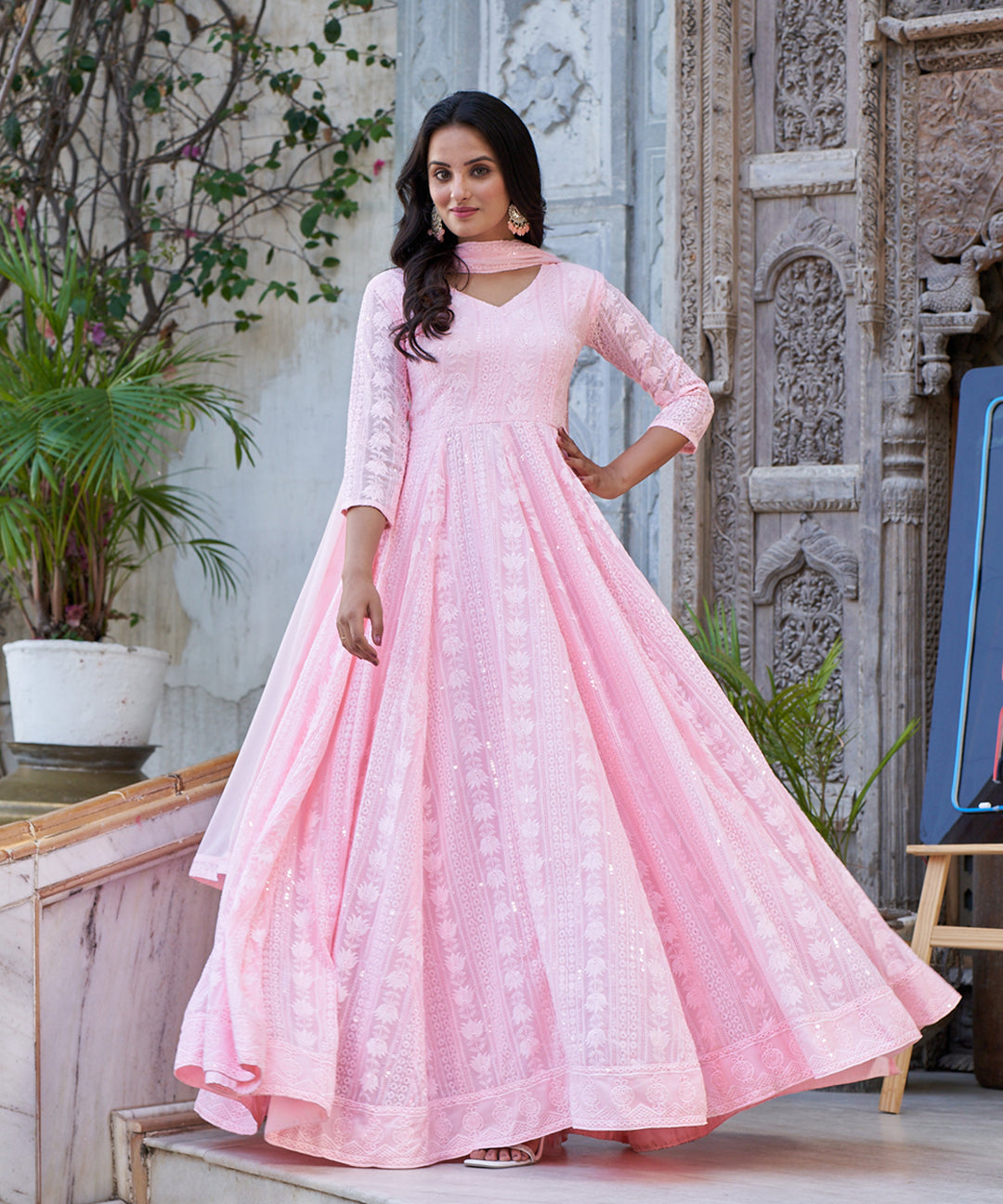 Light pink Lucknowi embroidered Georgette Anarkali suit featuring intricate detailing and a graceful design