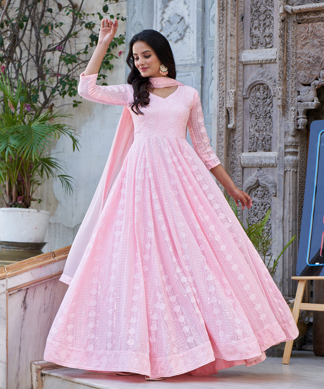 Light pink Lucknowi embroidered Georgette Anarkali suit featuring intricate detailing and a graceful design