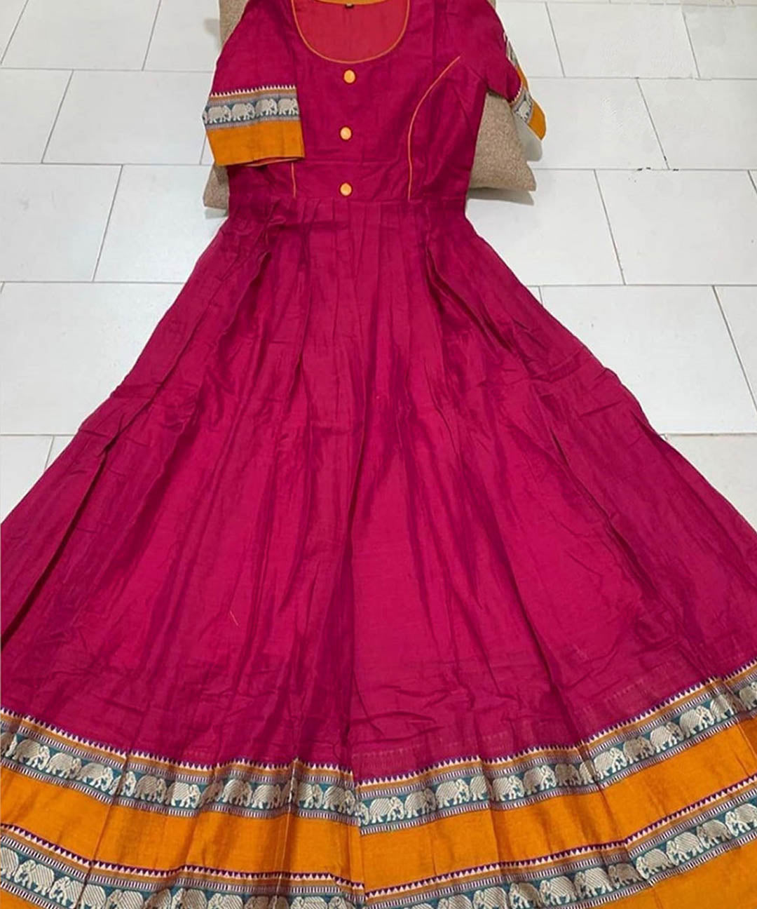 Magenta colored partywear satin silk gown with trendy print, ideal for stylish occasions.