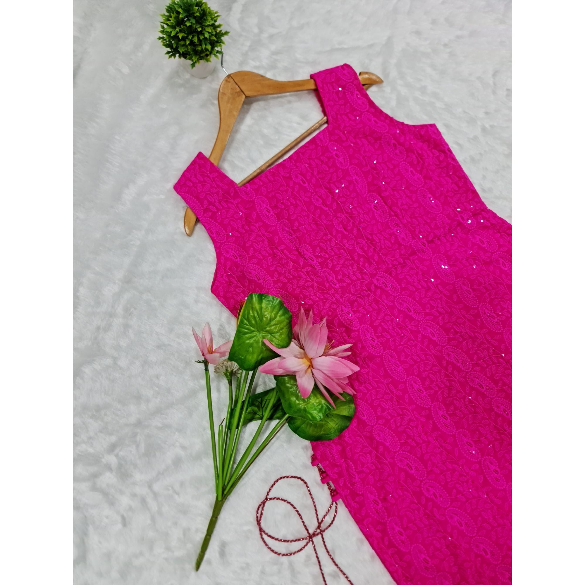 Vibrant Magenta Kurti with Side Tassels: A stunning long kurti in a captivating shade of magenta, adorned with intricate Chikankari embroidery and playful side tassels.