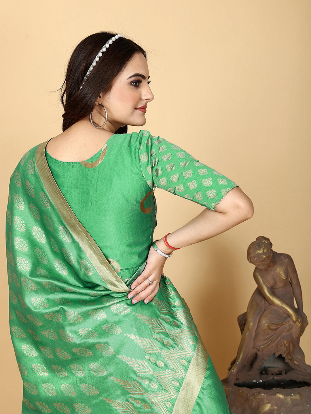 A show-stopping designer sharara set in a mesmerizing shade of magnetic green. Woven for a luxurious feel, this set features a flattering top and wide-leg sharara pants.